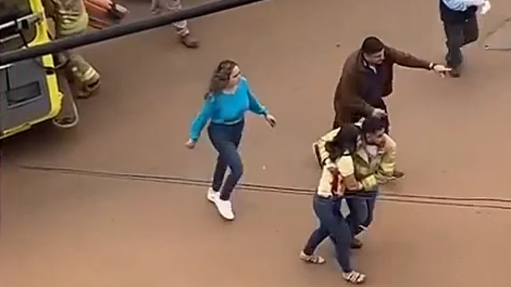 La mujer que fue tomada de rehén esta mañana en Concepción y recibió una herida permanece en grave estado.Foto: Captura.